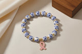 Pink or Blue Ceramic Beaded Bracelet with a Breast Awareness Ribbon