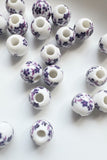purple and white flower ceramic beads uk